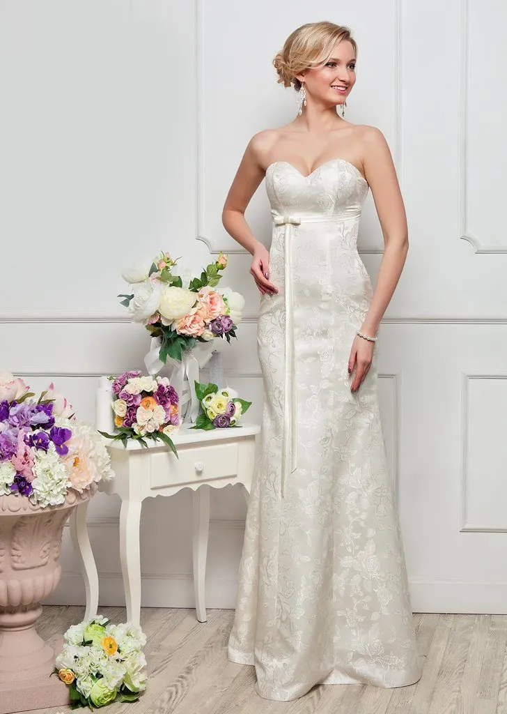 ---Mermaid style wedding and ceremony dress, made of lace with satin lining, features a waist strap with bow--