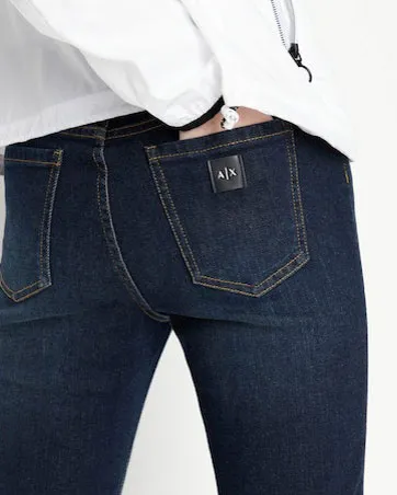 Jeans vestibilità skinny a vita alta in cotone stretch blu lavaggio scuro mirato con patch logo sul retro